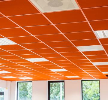 Brightly coloured acoustic ceilings in a classroom