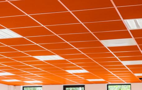 Brightly coloured acoustic ceilings in a classroom